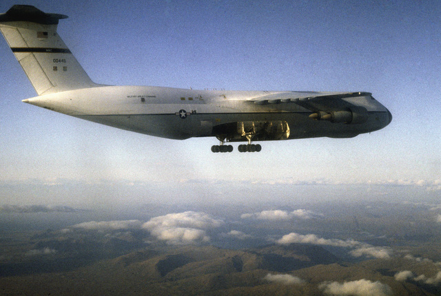 An Air To Air Right Side View Of A Damaged 60th Military Airlift Wing C