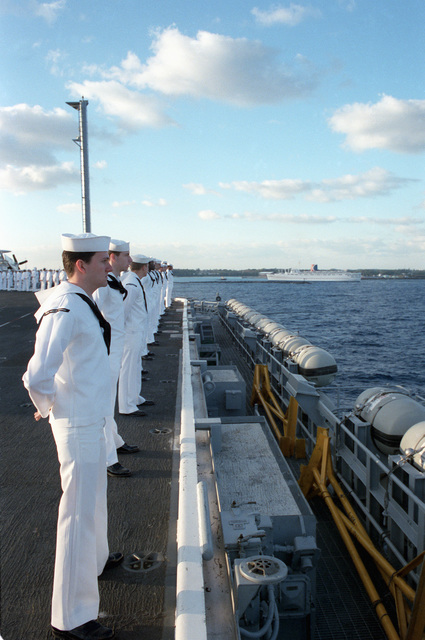 Sailors Man The Rail As The Nuclear Powered Aircraft Carrier Uss