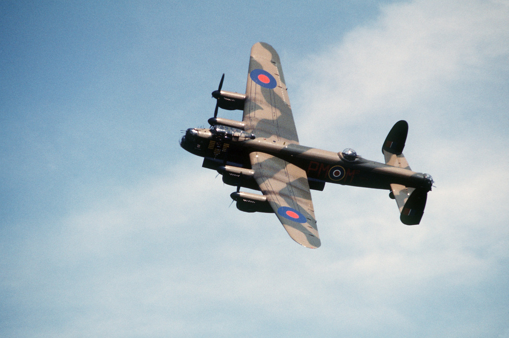 A Left Side View Of A World War Ii British Lancaster Aircraft In Flight