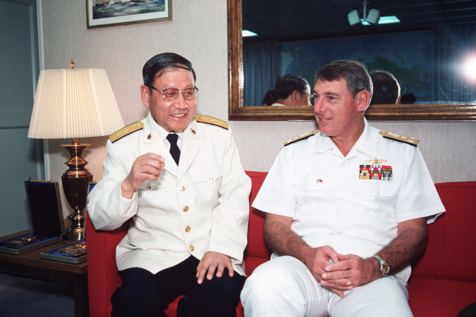 A Chinese Naval Officer Chats With Vice Admiral VADM Henry H Mauz Jr