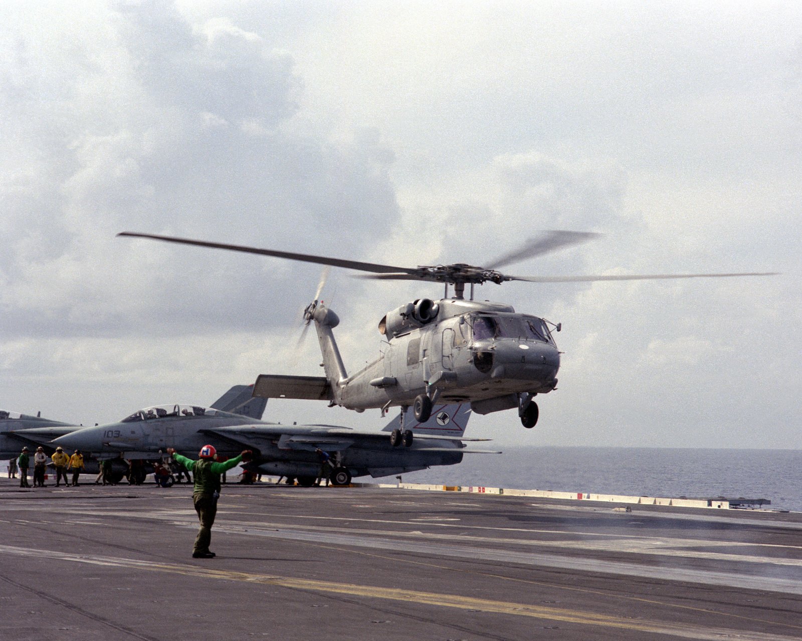 An SH 60F Sea Hawk Helicopter Lifts Off From The Flight Deck Of The