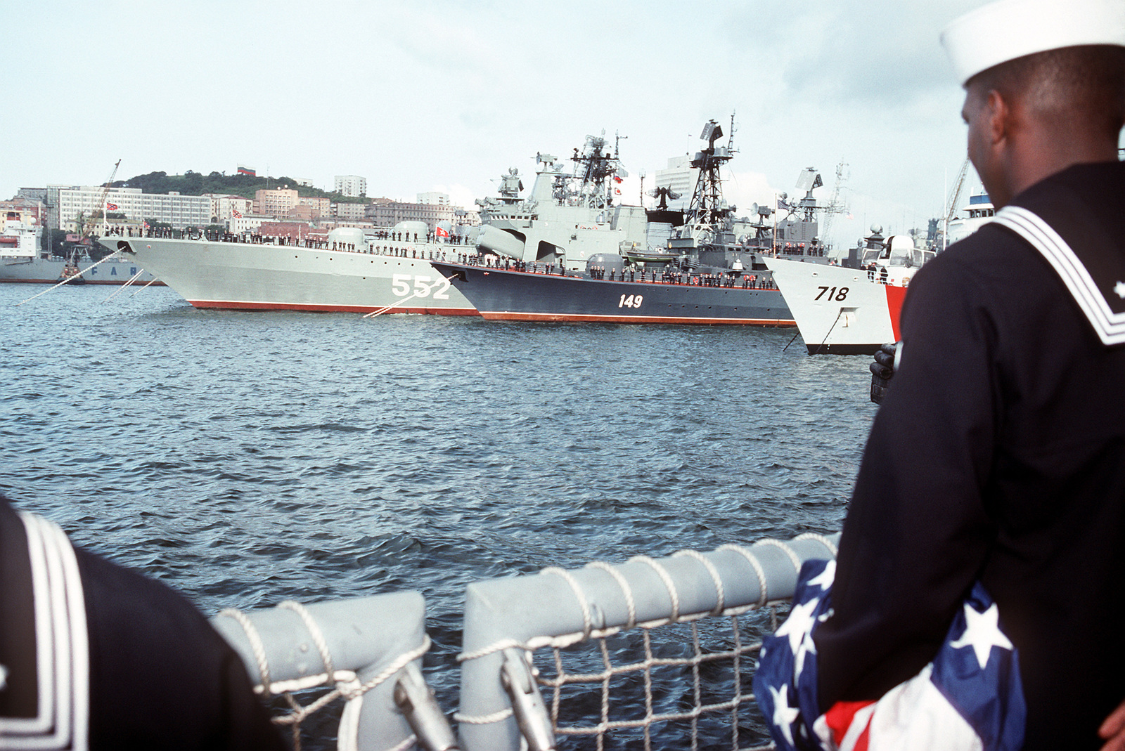 A Sailor On The Stern Of The Guided Missile Frigate USS MCCLUSKY FFG