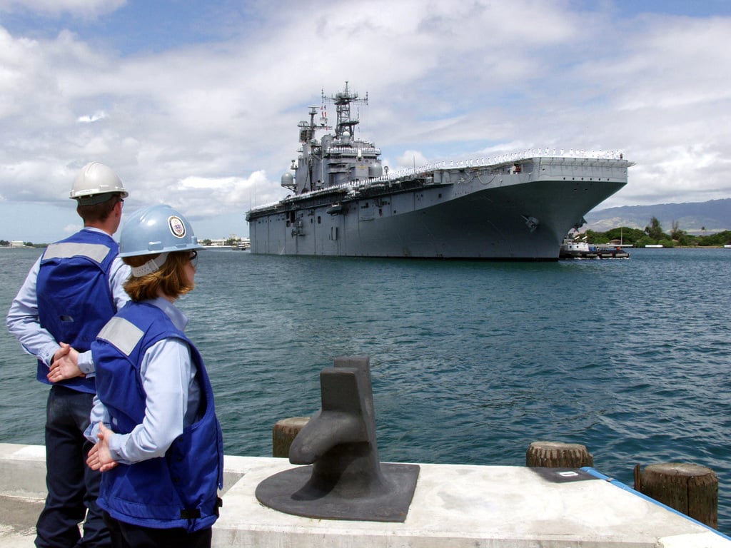 Two Us Navy Usn Sailors Standby To Tie Up A Ship At A Mooring Bitt On