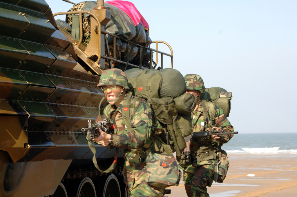 Republic Of Korea ROK Marines Rush Out Of An AAV 7A1 Amphibious