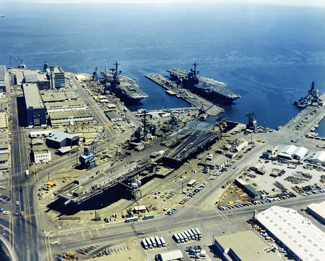 An aerial view of Hunter's Point Naval Shipyard with three docked ...