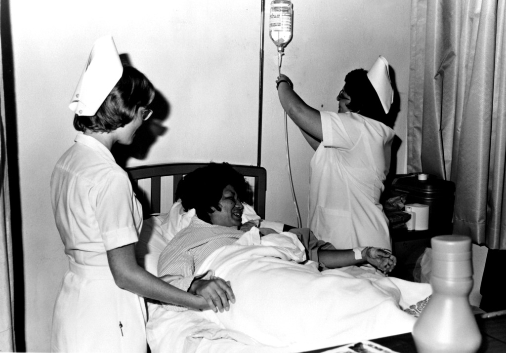 STAFF nurses administer medication intravenously to a patient at the U ...