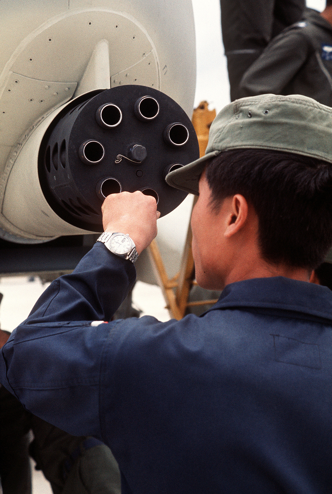 A Korean Airman Examines The General Electric Gau 8 A Avenger 30mm Seven Barrel Cannon Mounted