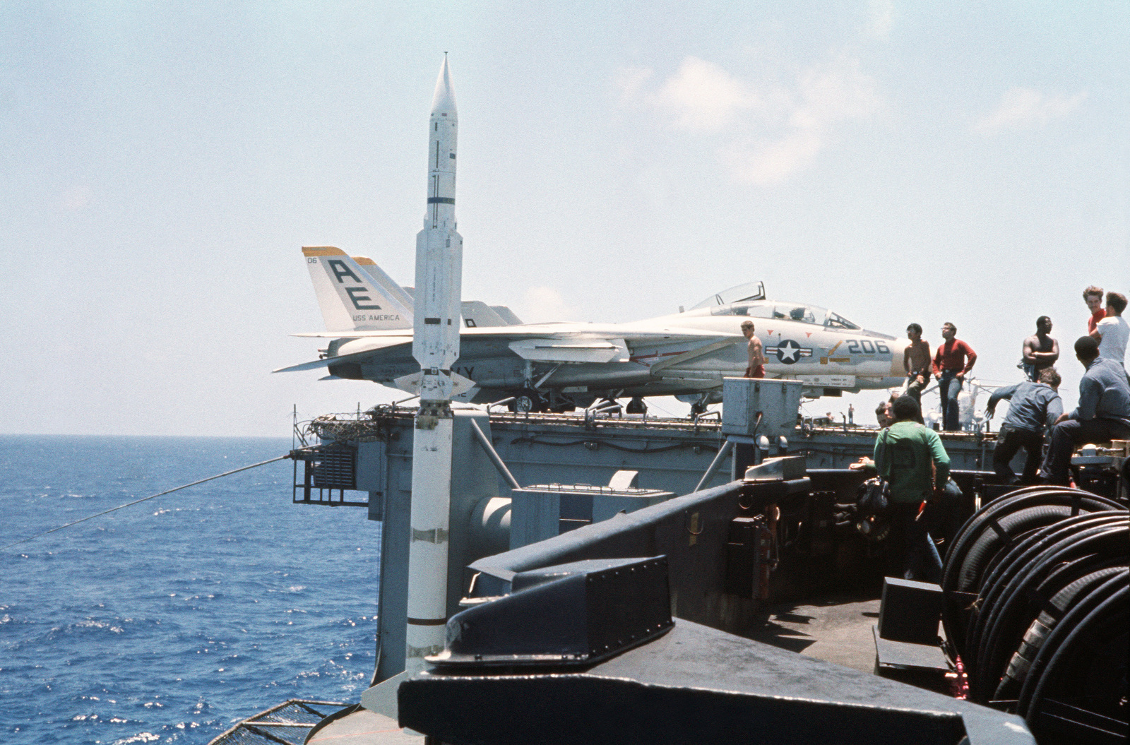 Crewmen stand by prior to the launch of an RIM-67B Standard missile ...