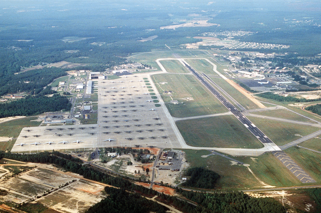 An aerial view of C-141 Starlifter and C-130 Hercules aircraft parked ...