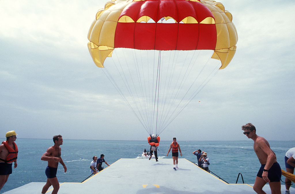 Astronaut Anna Fisher takes off on a parafoil flight over Biscayne Bay ...