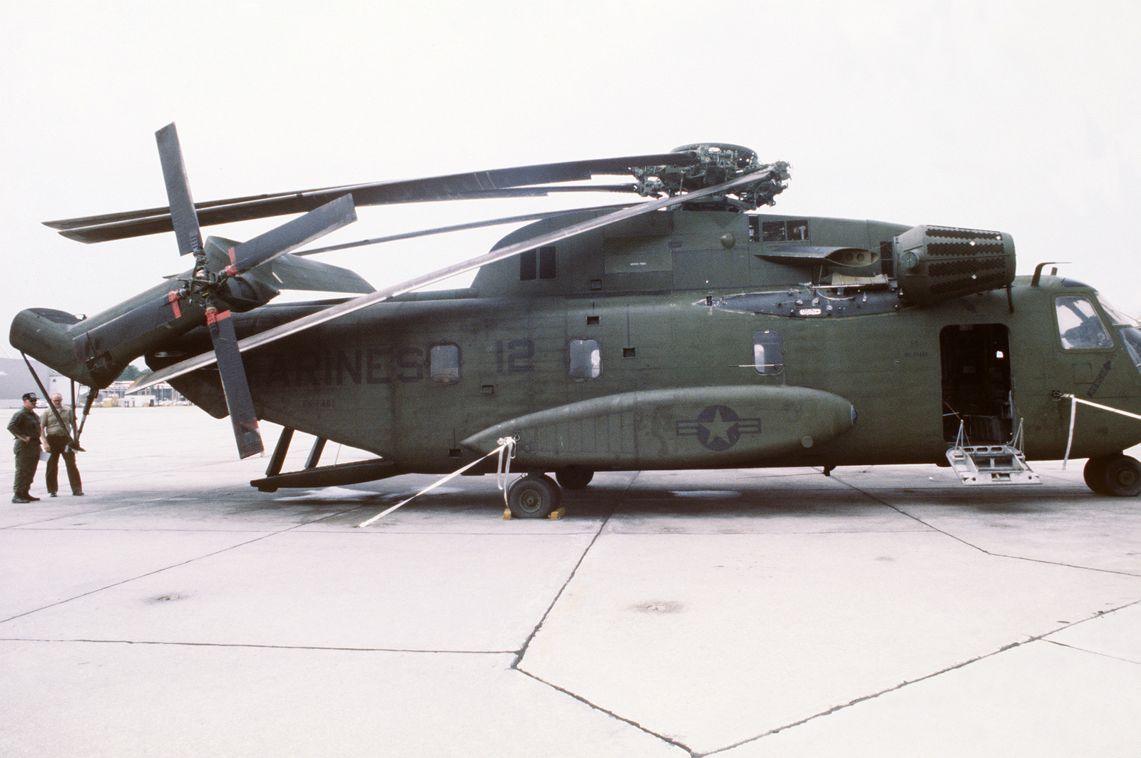 A CH-53 Sea Stallion helicopter is disassembled for transport - NARA ...