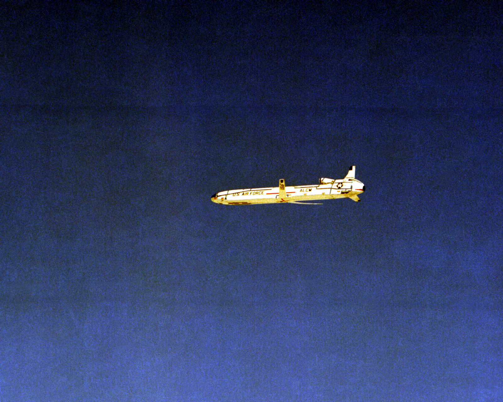 A Side View Of An AGM-86 Air-launched Cruise Missile In Flight After ...