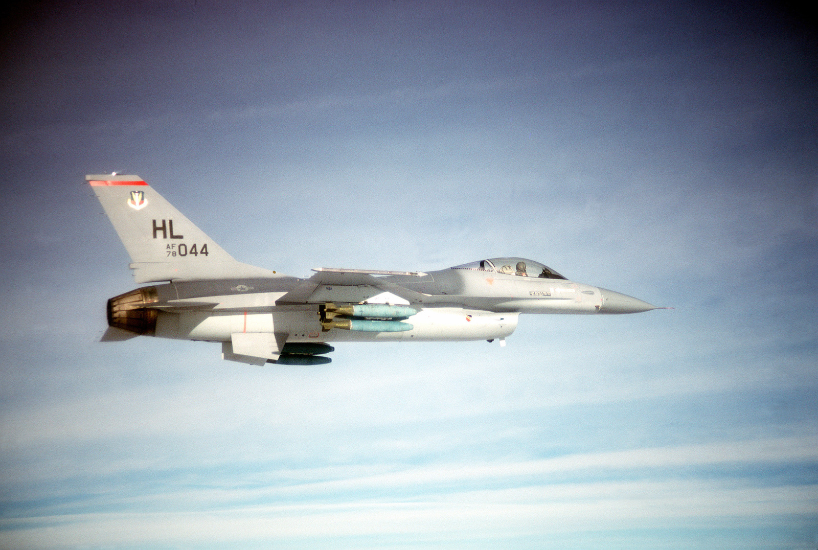 AN Air-to-air Right Side View Of An F-16 Fighting Falcon Aircraft Armed ...