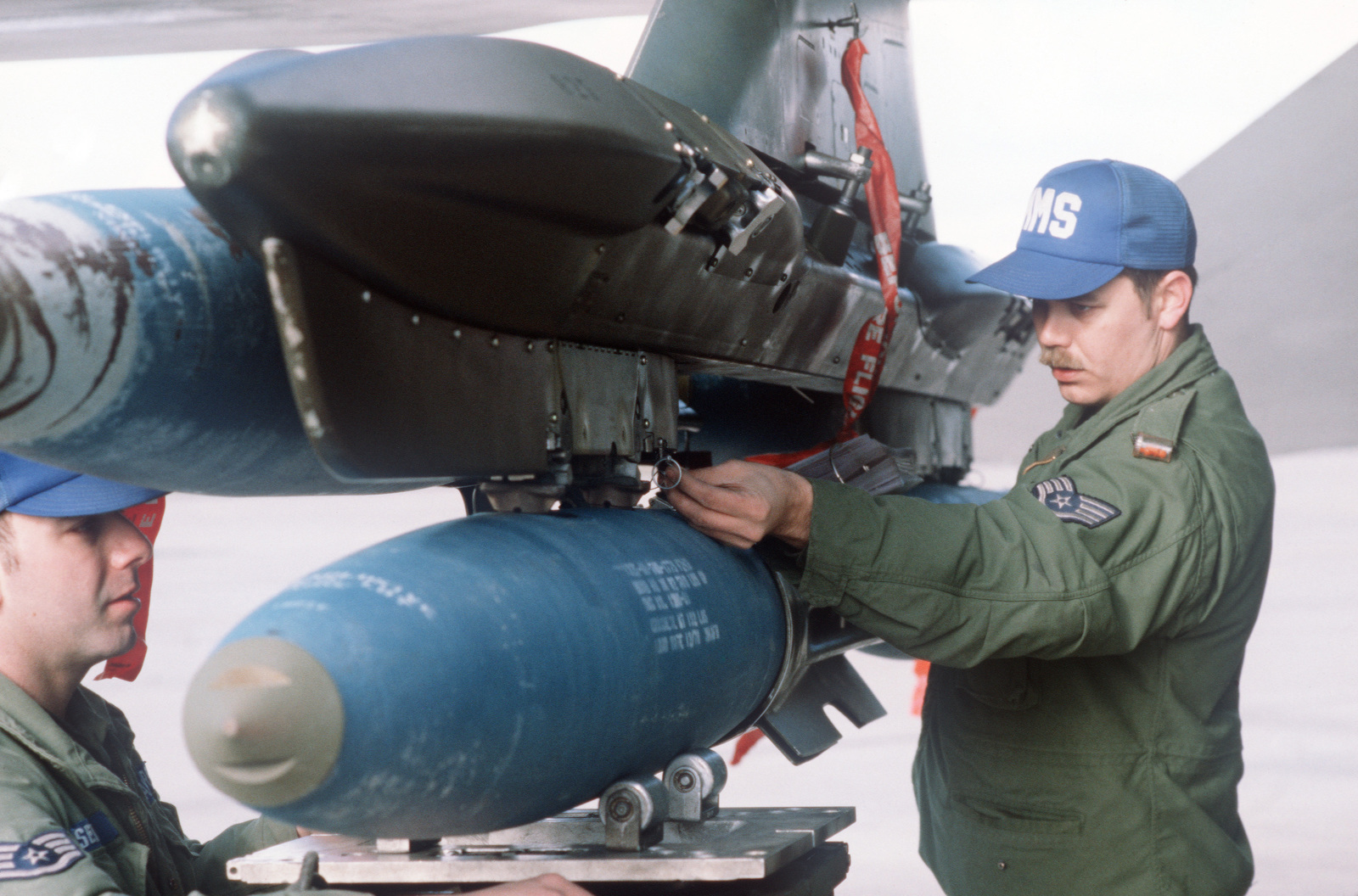 A Staff Sergeant Makes Final Adjustments On A Mark 82 500-pound High ...