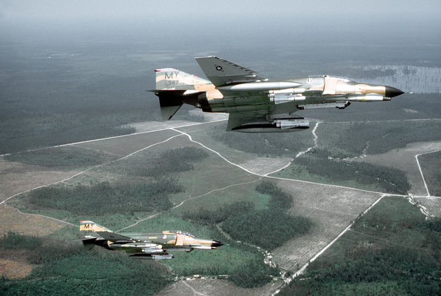 an-air-to-air-right-side-view-of-two-f-4e-phantom-ii-aircraft-banking-to-the-fb8f70-640.jpg