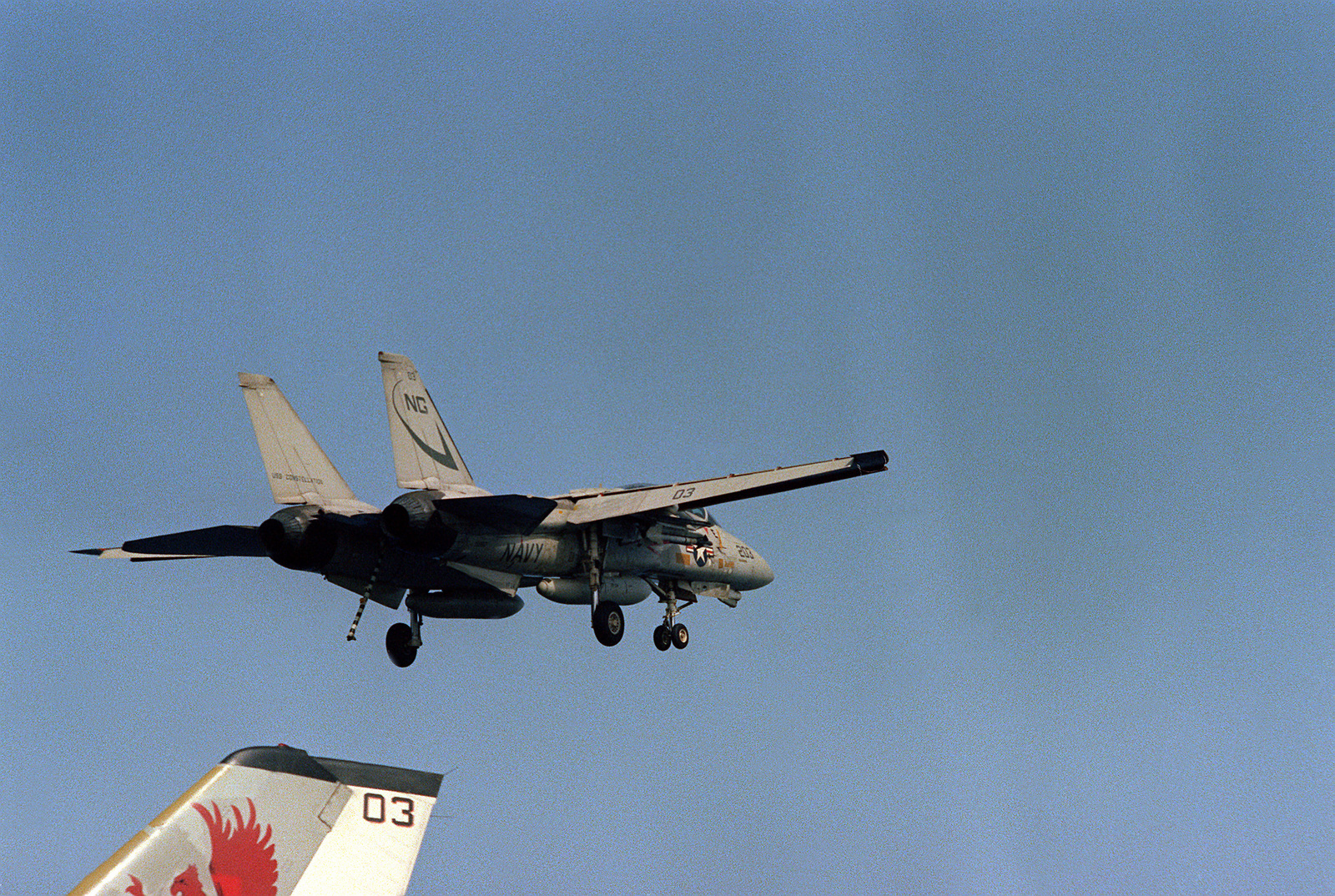 An F 14 Tomcat Aircraft With Arresting Hook Down Makes A - 