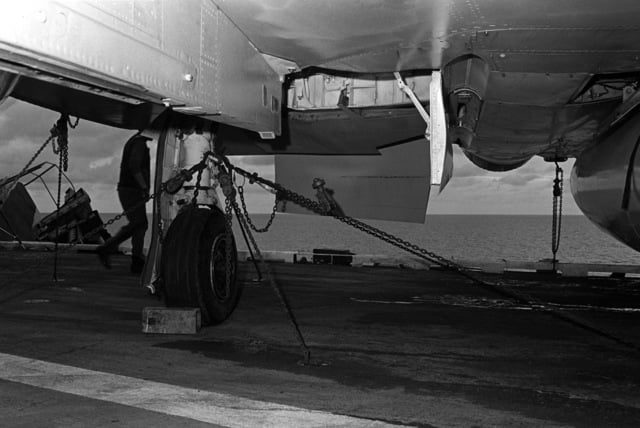 A close-up view of chains securing an aircraft to the flight deck of ...