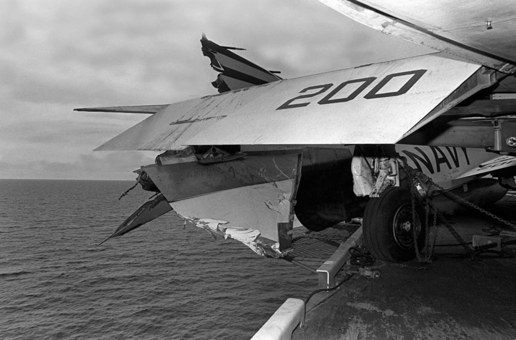 A view of damage caused to an F-4 Phantom II aircraft that was parked ...