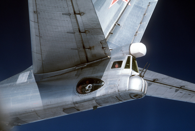 AN air-to-air left side view of the tail section of a Soviet Tu-95 Bear ...