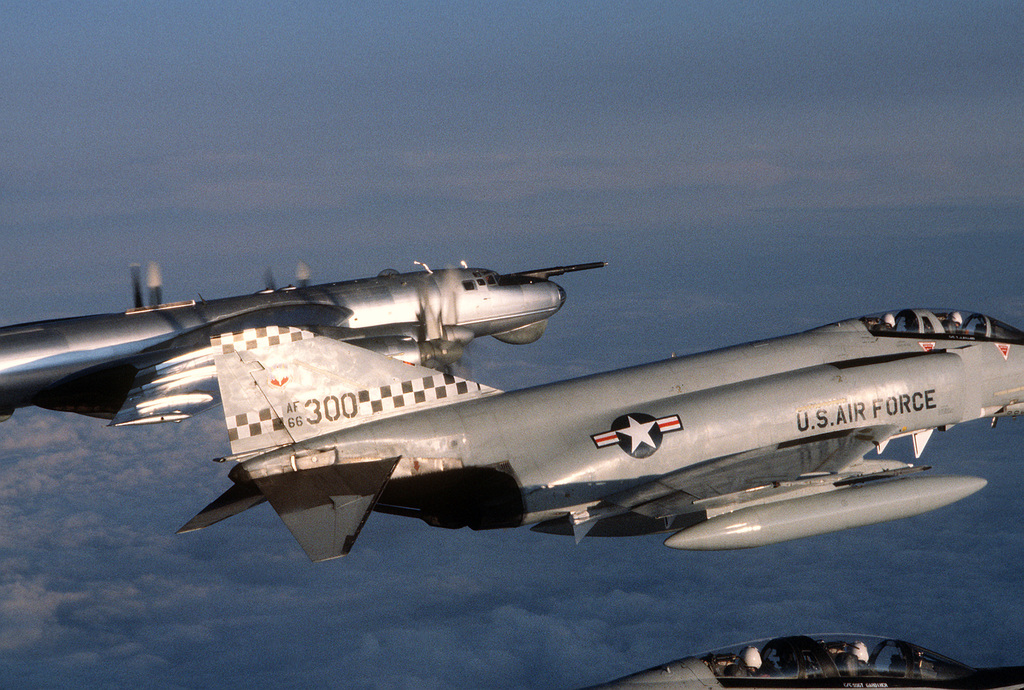 AN air-to-air right side view of two F-4 Phantom II aircraft observing a  Soviet TU-95 Bear aircraft, rear, over international waters - NARA & DVIDS Public  Domain Archive Public Domain Search