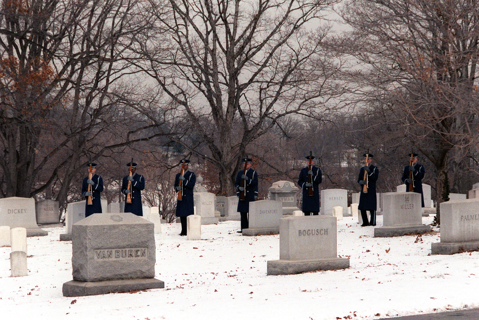 The Air Force Honor Guard fires a 21-gun salute at the conclusion of ...