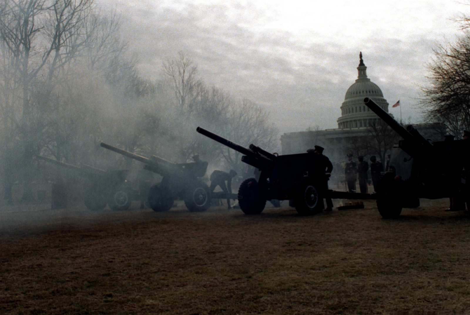 An Army 105mm howitzer artillery battery is located on the lawn behind ...