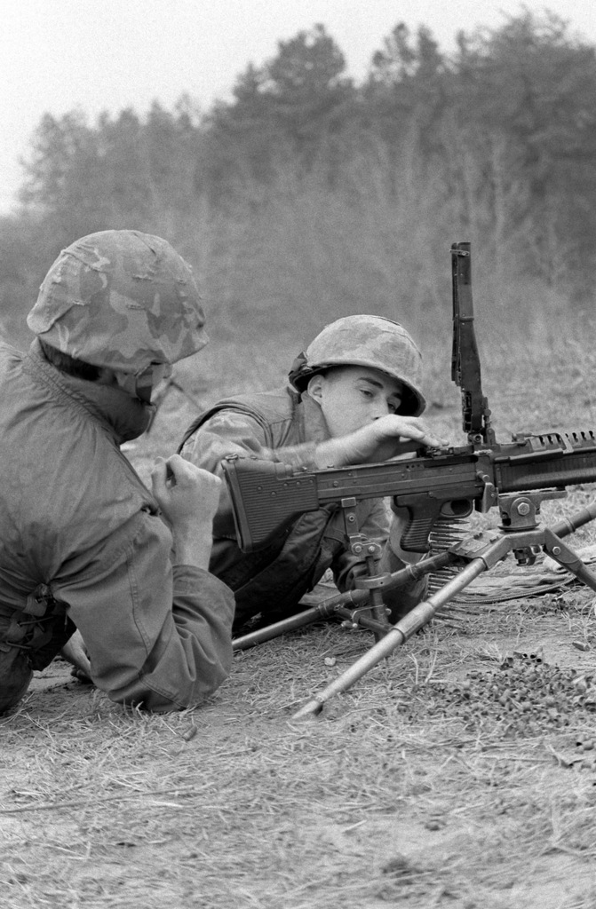 A Rotc Midshipman Reloads His M 60a1 Machine Gun On Range Three While