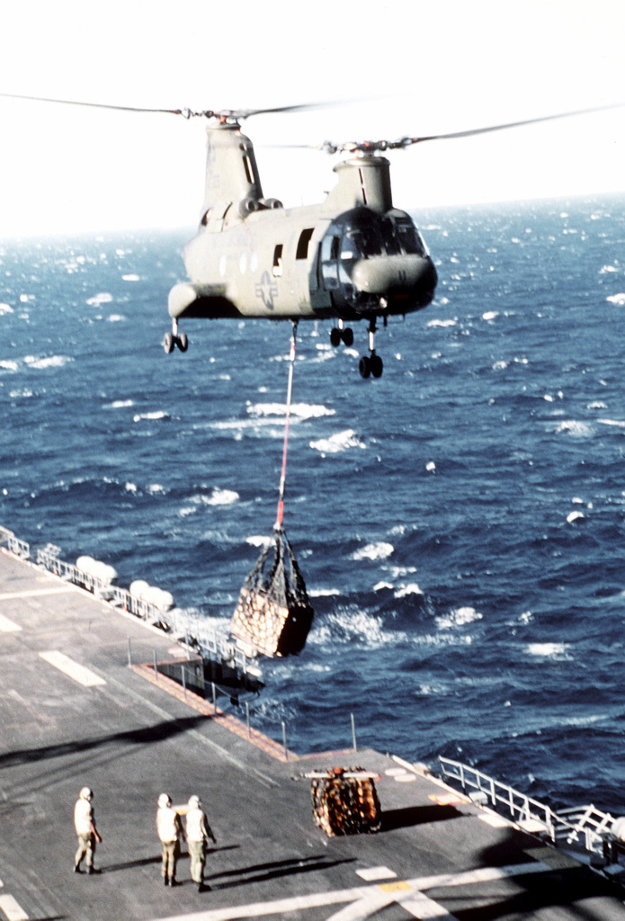 A USMC CH-46E (Sea Knight) helicopter from Marine Helicopter Squadron  Medium (HMM 262), come in for a landing on the flight deck of the USS Essex  (LHD 2). Marines from the 31st