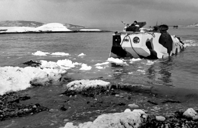 An amphibious armored personnel carrier lands on Kjerkevik Beach during