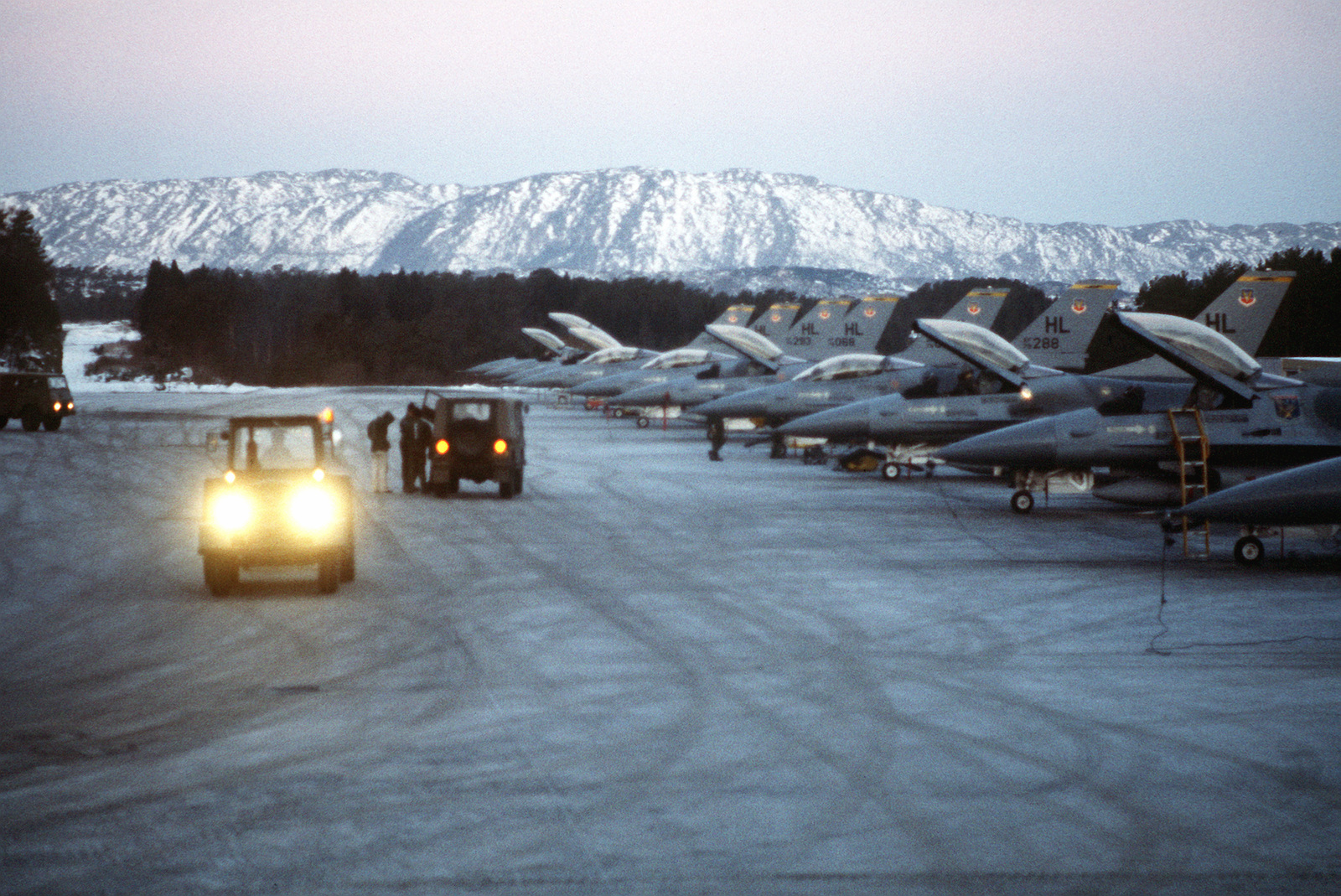 Early Morning View Of A Row Of Parked F-16 Fighting Falcon Aircraft ...