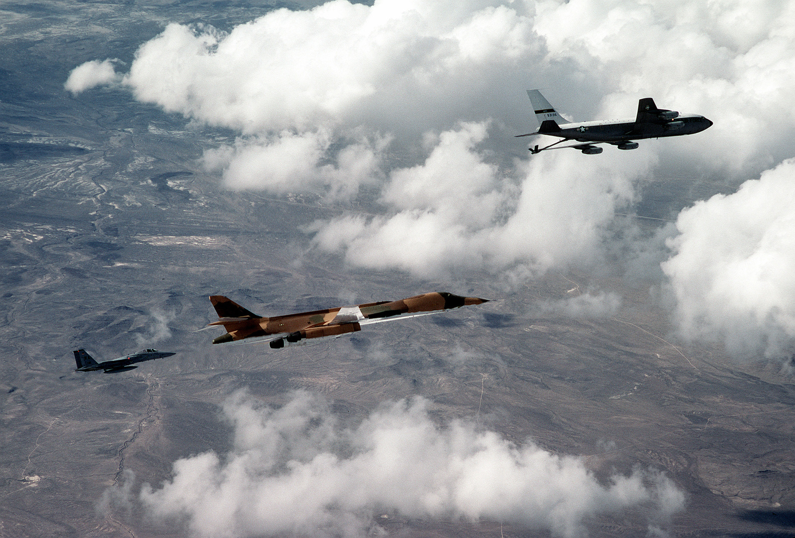 A Right Side View Of A B-1 Bomber Aircraft Approaching A KC-135 ...