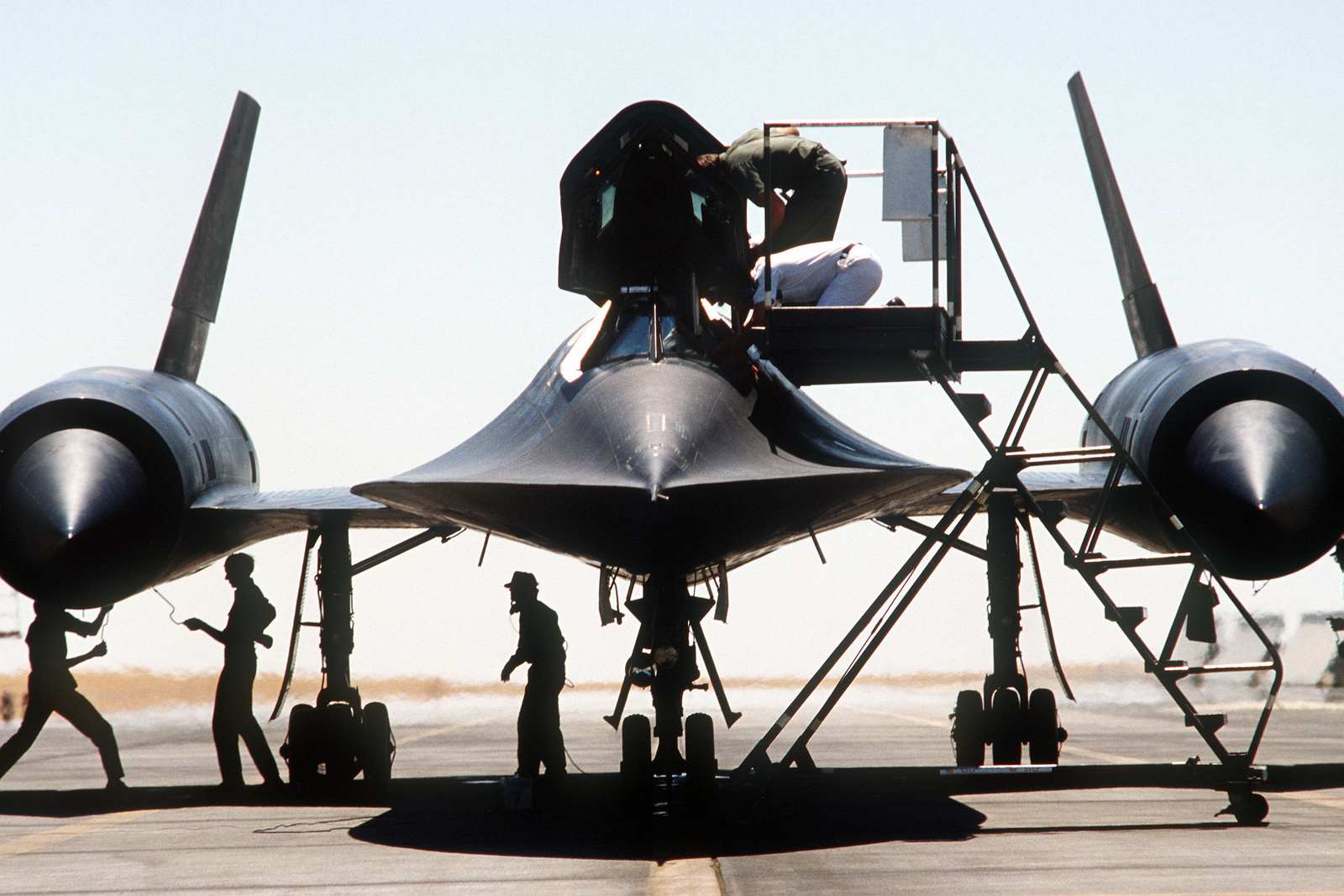 Front View Of An Sr 71 Blackbird Aircraft As Airmen Assist A Pilot Debarking The Aircraft