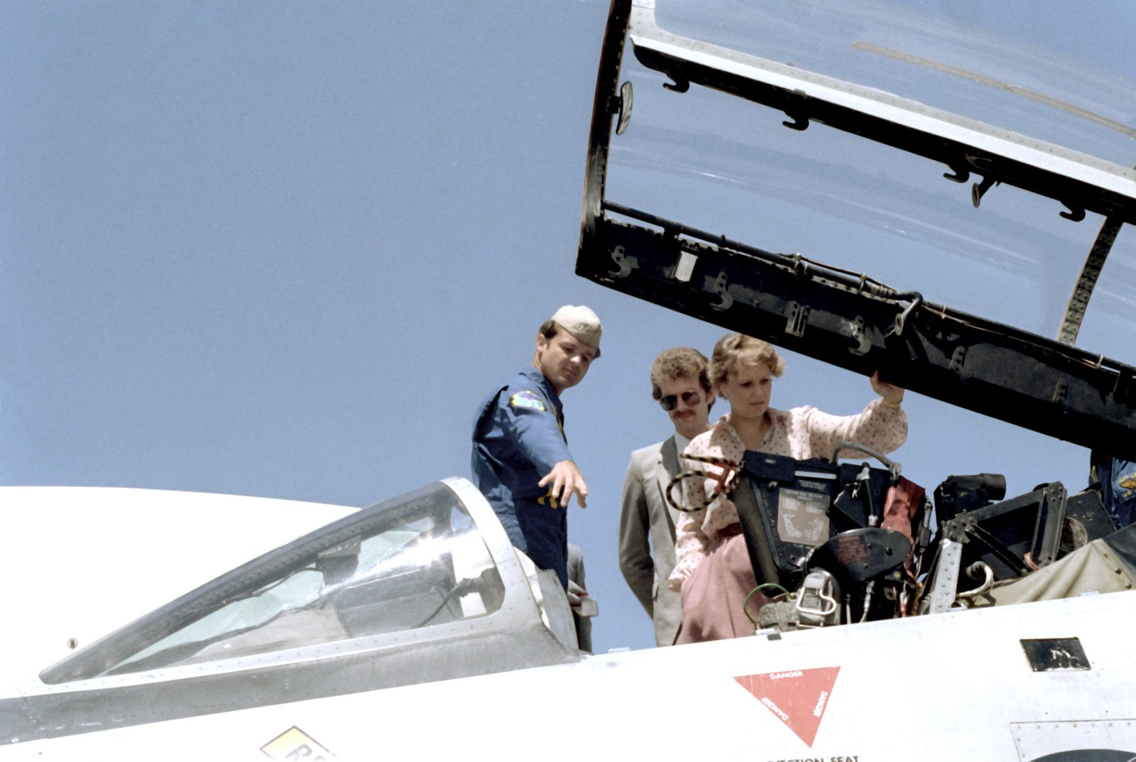 a-pilot-explains-the-cockpit-of-an-aircraft-to-maureen-reagan-during