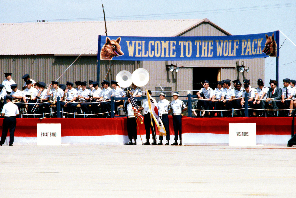 The Pacific Air Forces Band Color Guard And Visiting Dignitaries Await