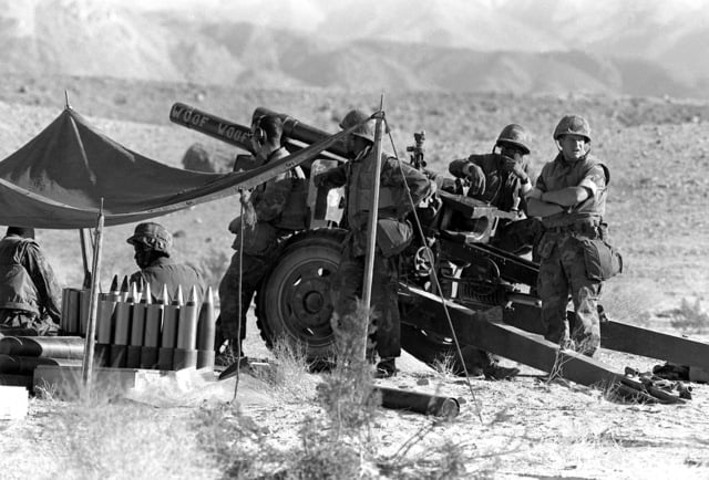 A 105mm Howitzer Team From Btry. H, 1ST Bn., 10th Marines, Stands By ...