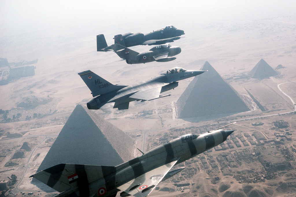 A right side view of aircraft in flight over the pyramids during