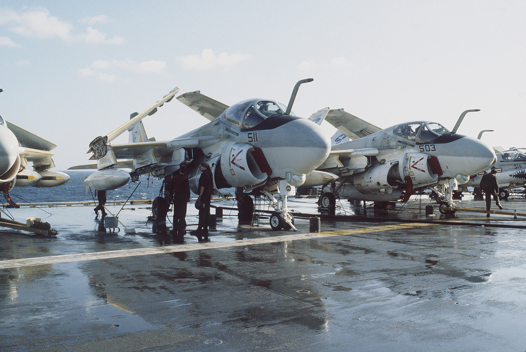 crewmen-wash-a-6e-intruder-aircraft-on-the-flight-deck-of-the-aircraft