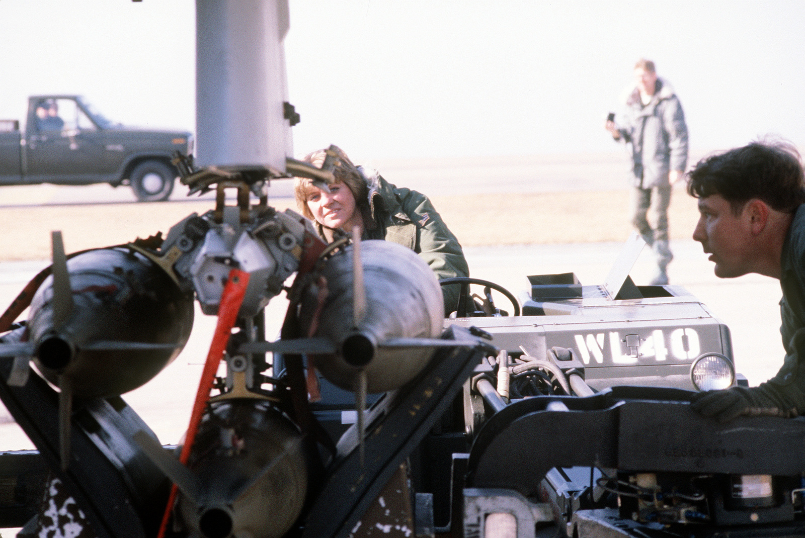 Ground Crewmen Line Up A Bomb Loader To An F-16 Fighting Falcon ...