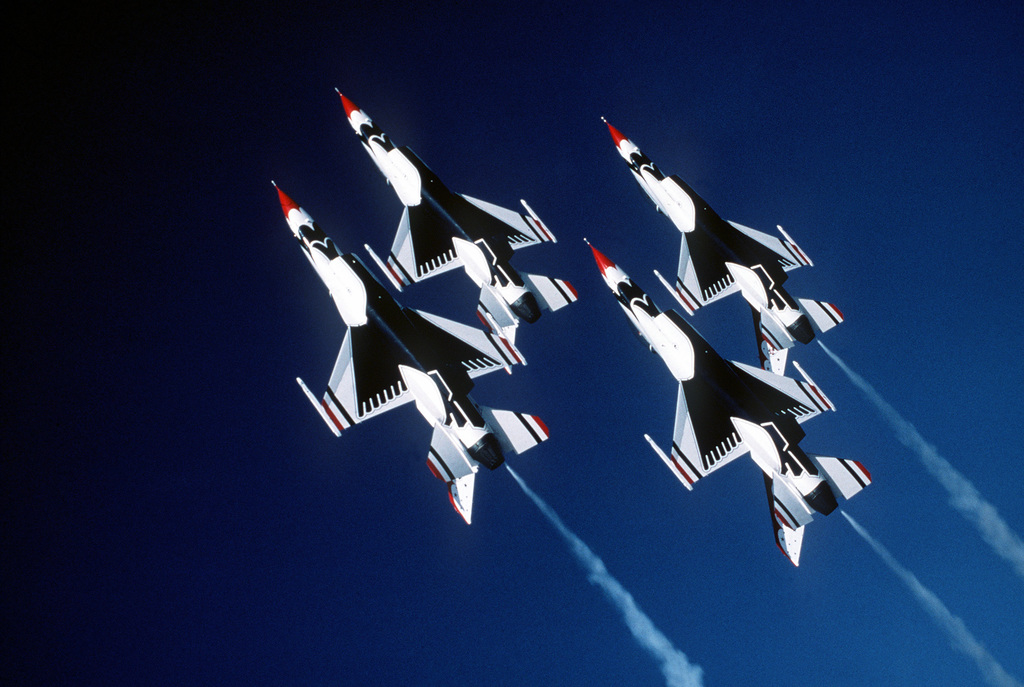 An air-to-air underside view of a four-ship diamond formation of the ...