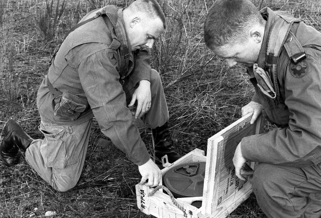 SSGT Larry Kemp, Company A, 15th Engineer Battalion, shows a fellow ...