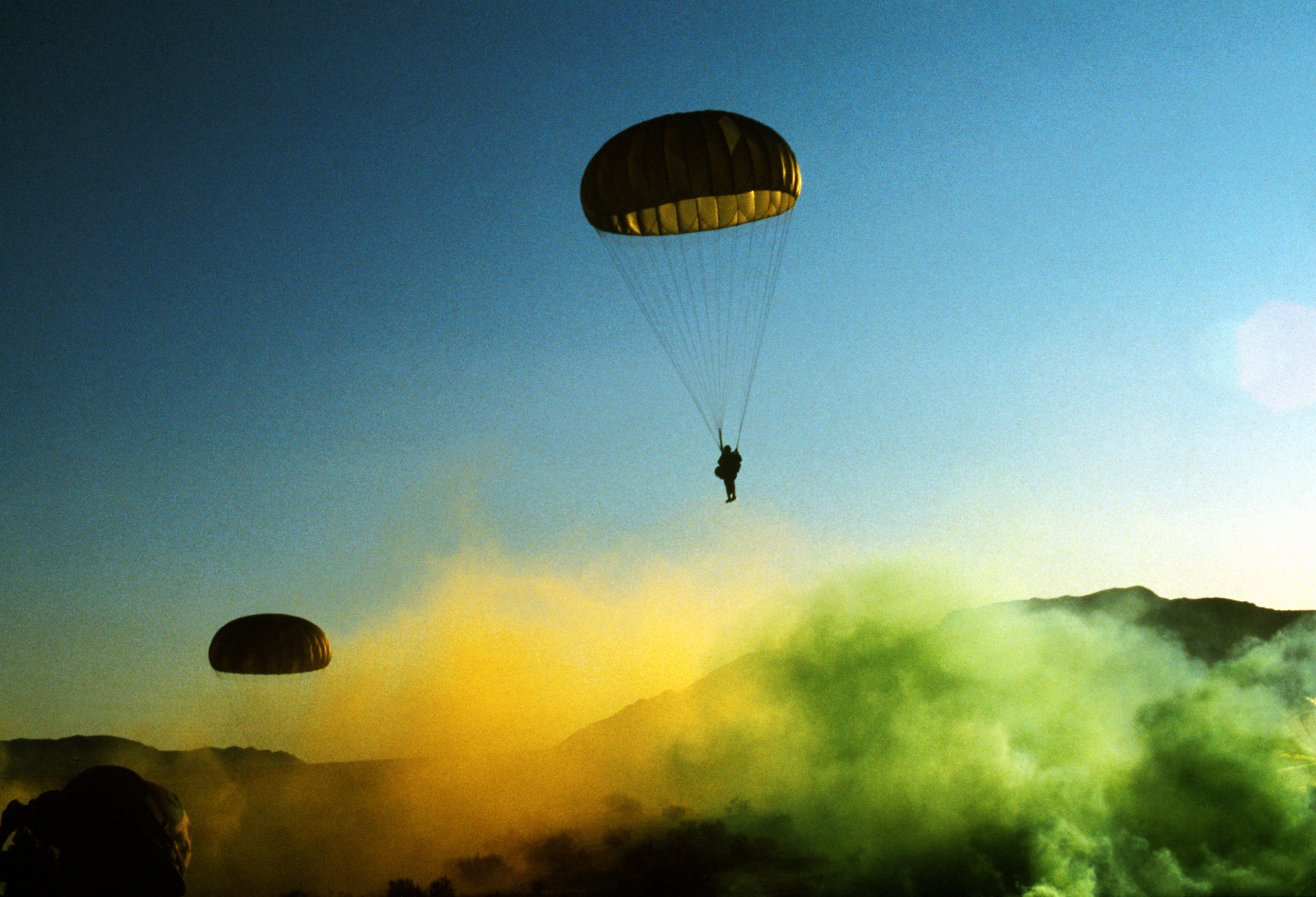 A Paratrooper From The 82nd Airborne Division Descends Into A Smoke 