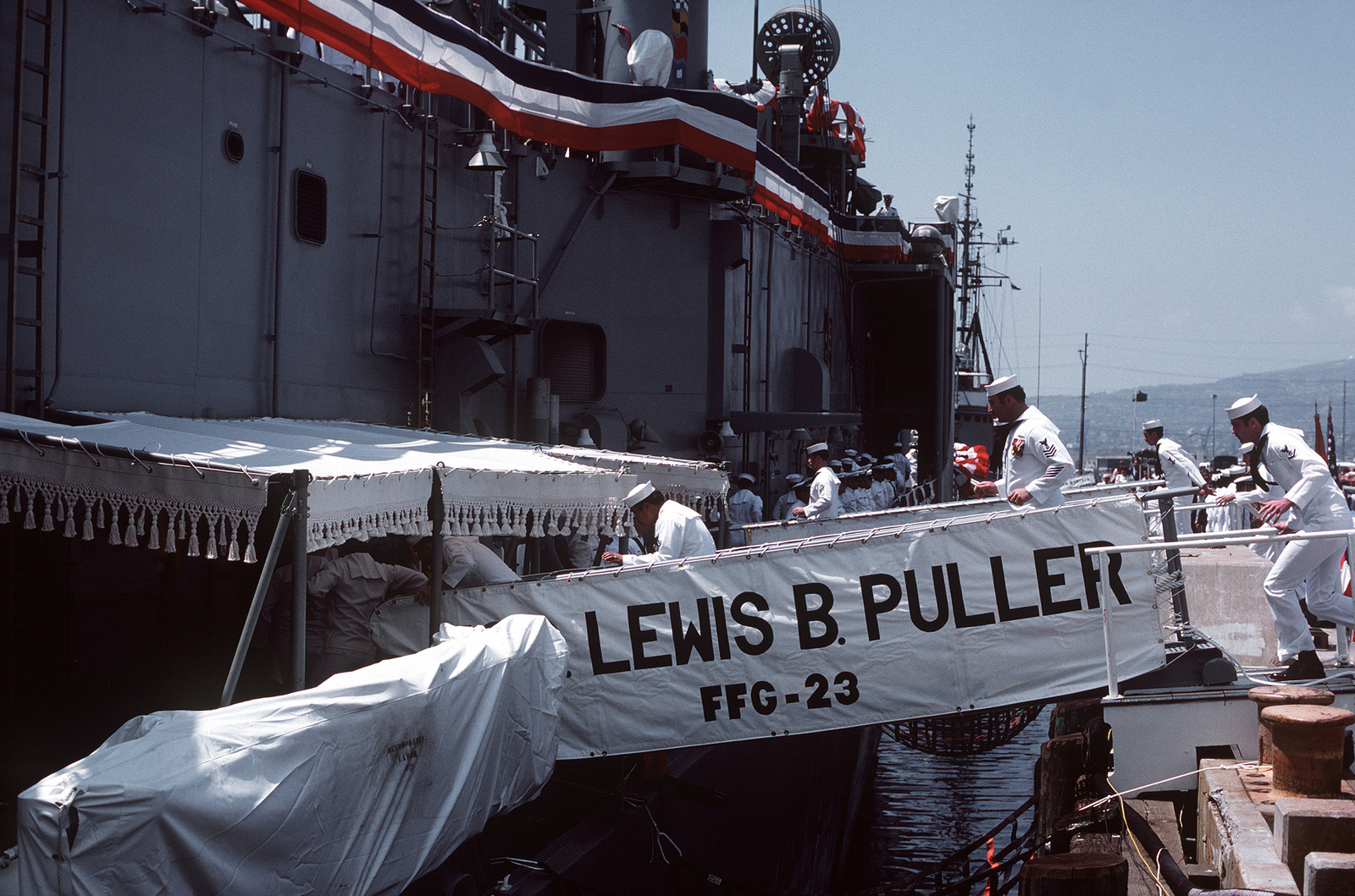 Crewmen Board The Missile Frigate USS LEWIS B. PULLER (FFG-23) During ...