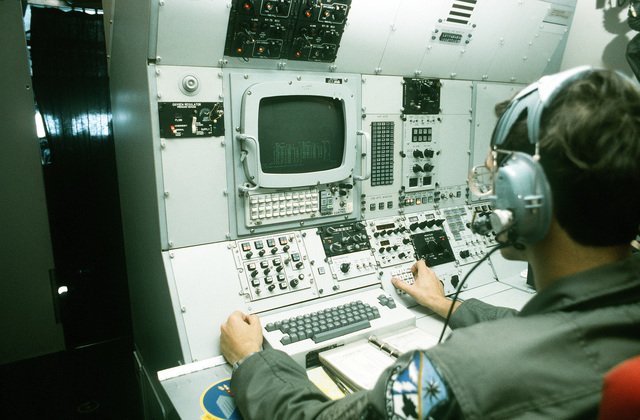 SSGT Zilavy operates a communications panel on board an E-3A Sentry ...