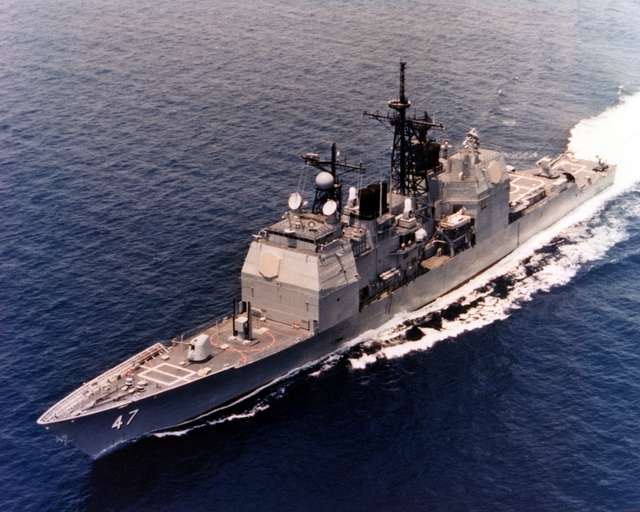 An aerial port bow view of the battleship USS IOWA (BB 61) battle group ...