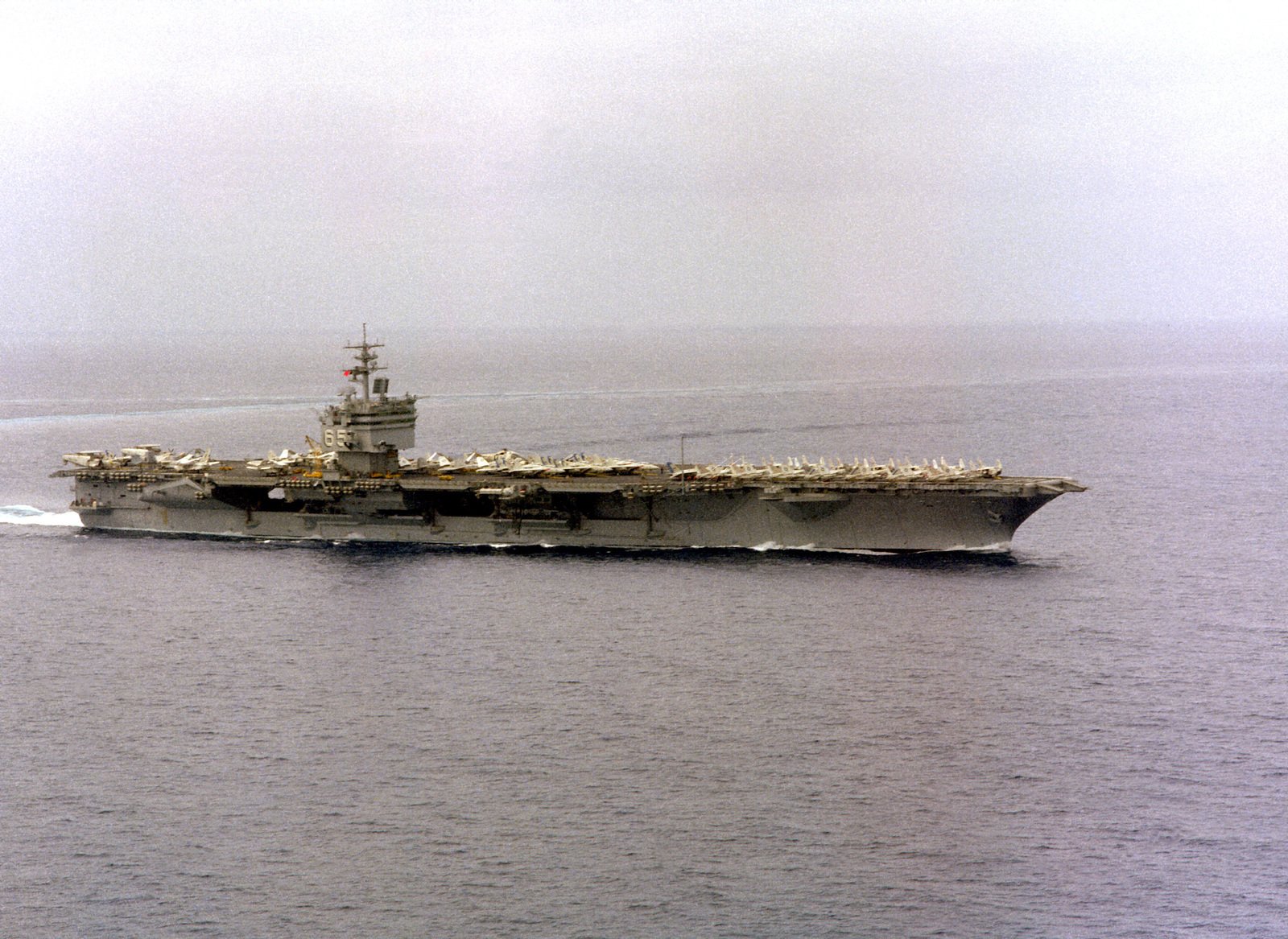 A starboard bow view of the nuclear-powered aircraft carrier USS ...