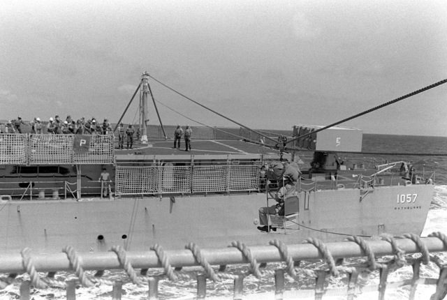 A manila high-line carries Chaplain (LT.) Gary Hill from the frigate ...