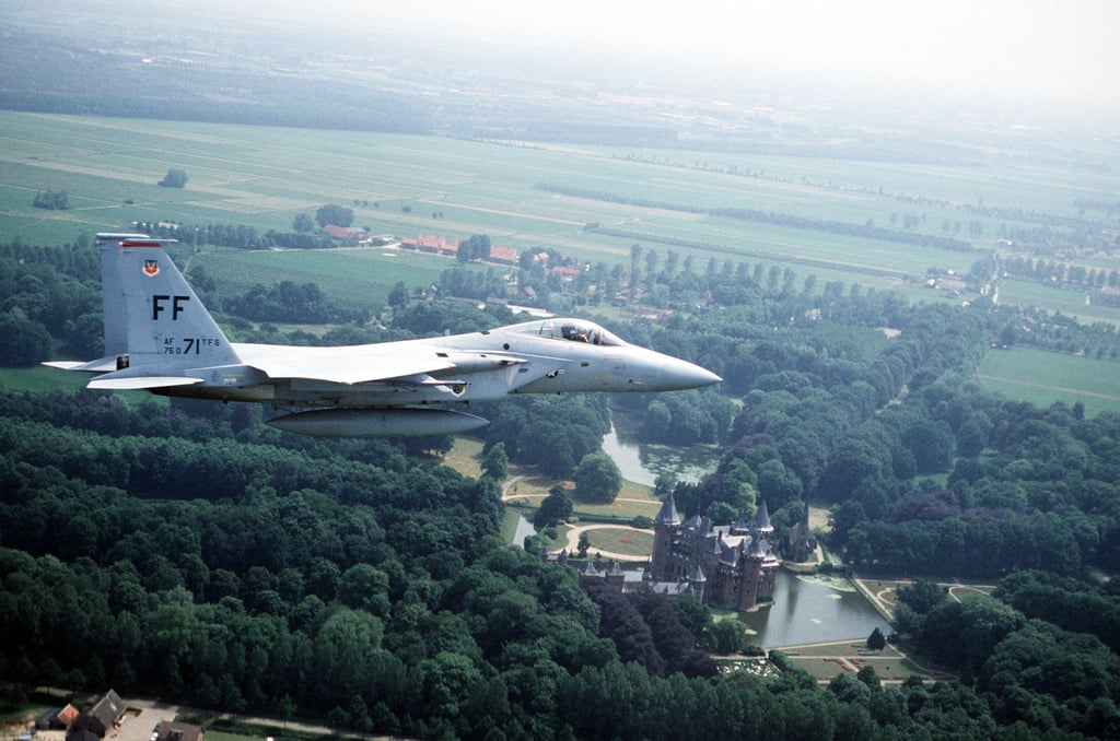 An right side view of an F-15A Eagle aircraft in flight during exercise ...