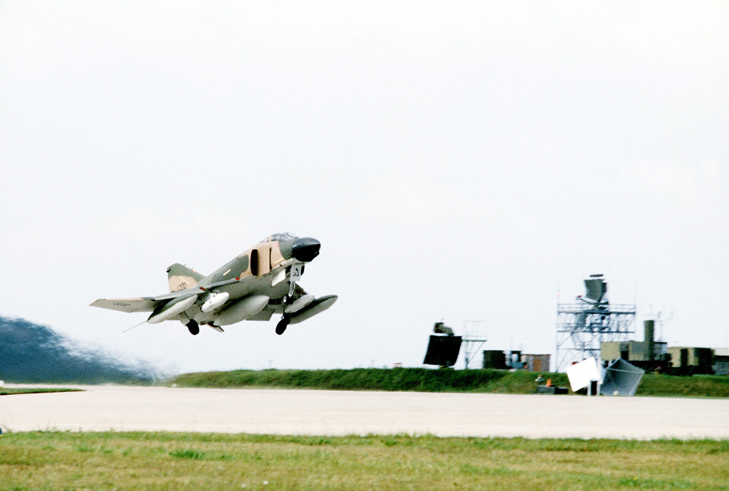 An F-4D Phantom II aircraft takes off, ending its assignment with the ...