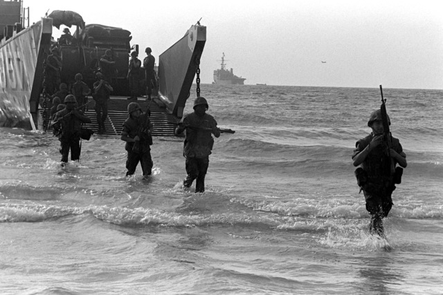 U.S. Marines disembark from utility landing craft 1657 (LCU-1657 ...