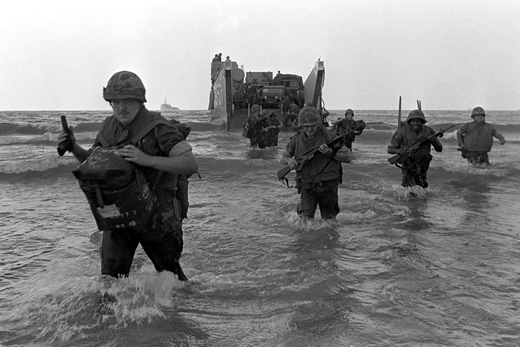 U.S. Marines leave a utility landing craft during landing operations at ...